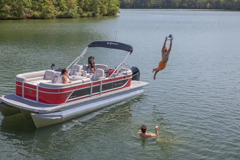 Slide: The Image of 2024 Sweetwater 2086 CX pontoon boat with people enjoying water activities. - 7