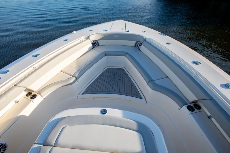 Slide: The Image of Luxurious seating area on 2026 Scout 425 LXF boat, featuring elegant design and comfortable cushions. - 10