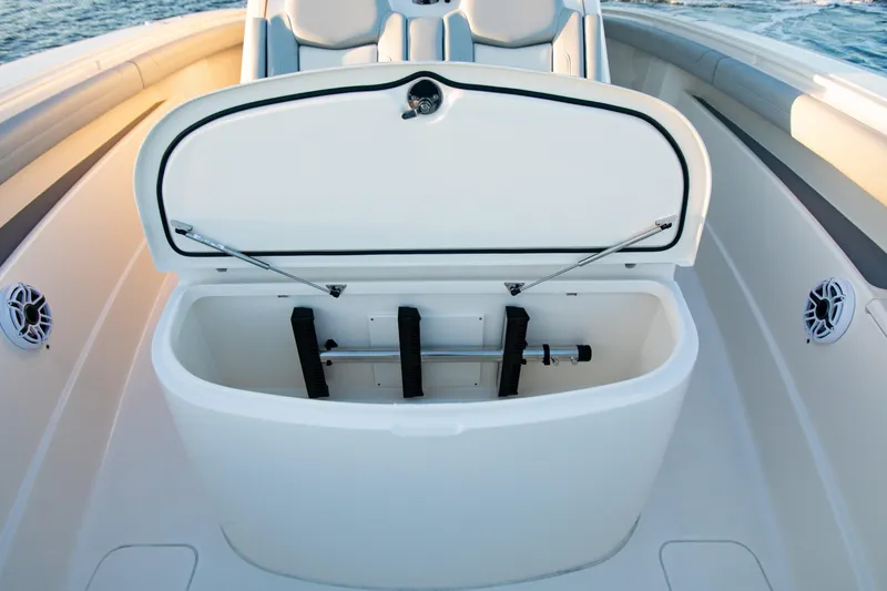 Slide: The Image of Open storage compartment on 2026 Scout 425 LXF boat, featuring sleek design and spacious interior. - 14