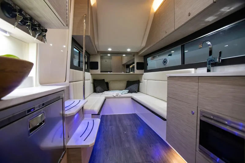 Slide: The Image of Luxurious interior of 2026 Scout 425 LXF boat with modern amenities and cozy seating. - 29