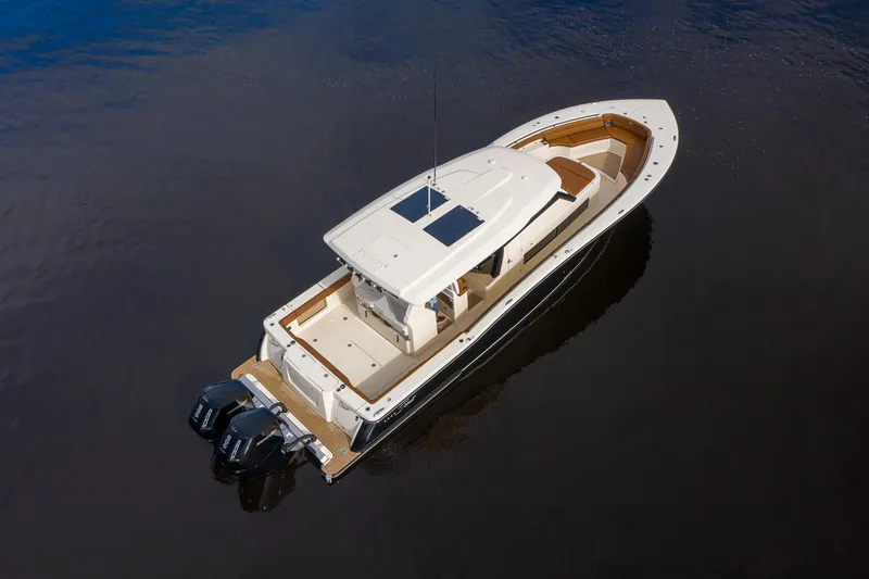 Slide: The Image of 2026 Scout 425 LXF boat on calm water, aerial view. - 3
