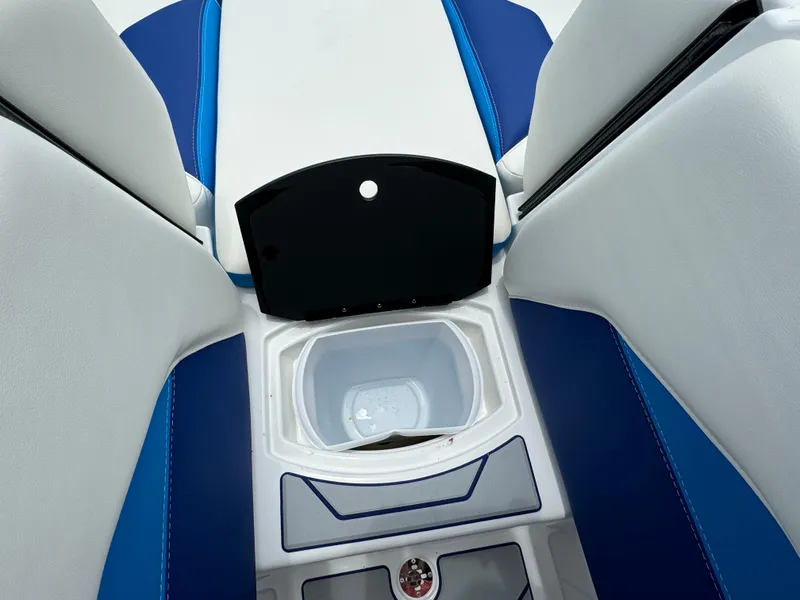 Slide: The Image of 2024 Malibu Wakesetter 21 LX interior with open storage compartment. - 17