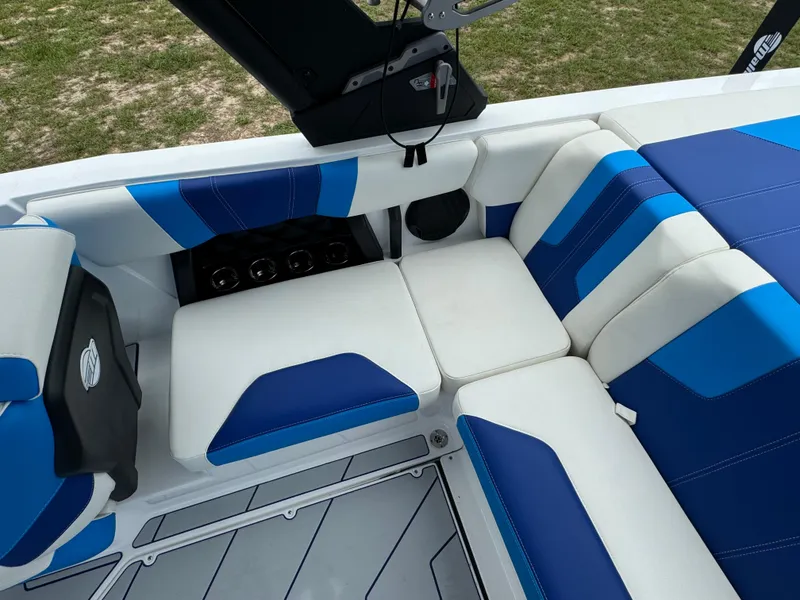 Slide: The Image of Interior seating of 2024 Malibu Wakesetter 21 LX boat with blue and white upholstery. - 27