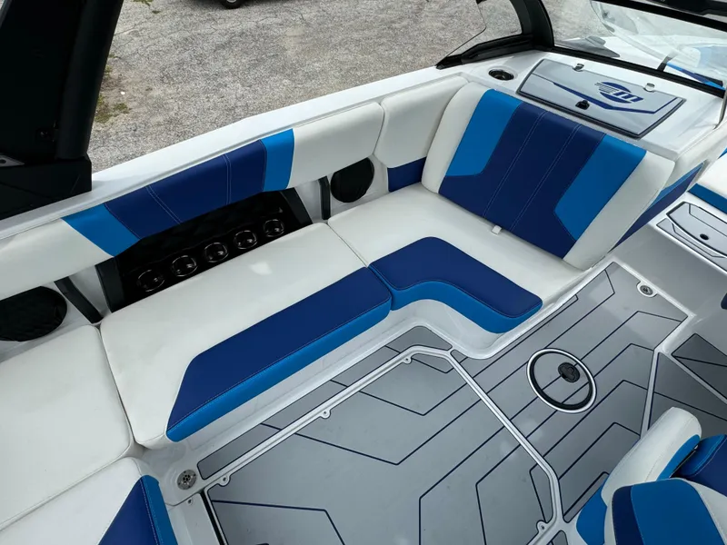 Slide: The Image of 2024 Malibu Wakesetter 21 LX interior with blue and white seating. - 30