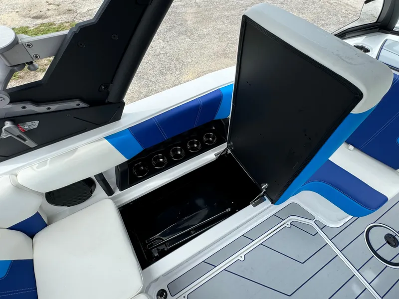 Slide: The Image of 2024 Malibu Wakesetter 21 LX boat interior with open storage compartment. - 33