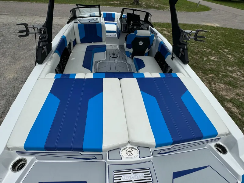 Slide: The Image of 2024 Malibu Wakesetter 21 LX interior with blue and white seating. - 37