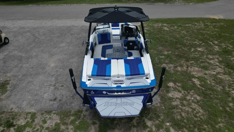 Slide: The Image of 2024 Malibu Wakesetter 21 LX boat, top view, blue and white interior. - 5