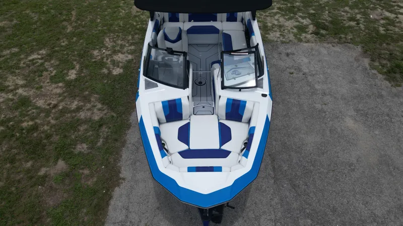 Slide: The Image of 2024 Malibu Wakesetter 21 LX boat, top view, blue and white interior. - 8