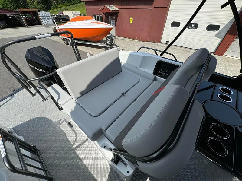 Slide: The Image of 2024 Princecraft VOGUE 23RL boat interior with Mercury engine and seating area. - 29