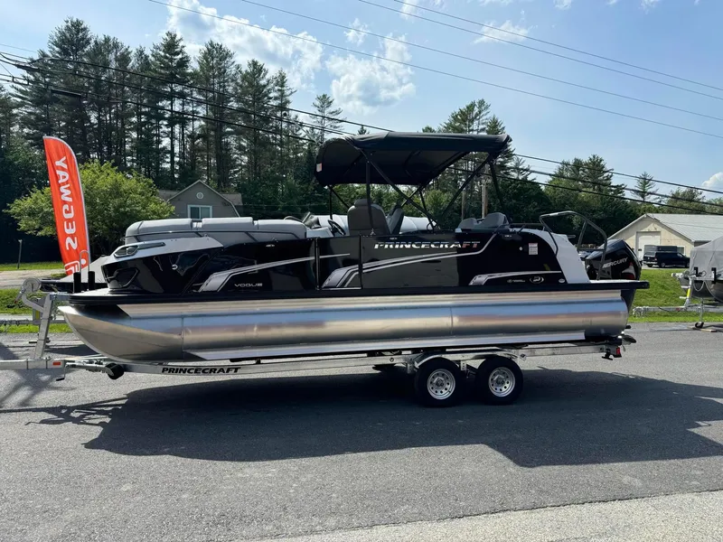 Slide: The Image of 2024 Princecraft VOGUE 23RL pontoon boat on a trailer, outdoor display. - 3