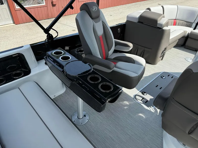 Slide: The Image of 2024 Princecraft VOGUE 23RL boat interior with captain's chair and cup holders. - 30