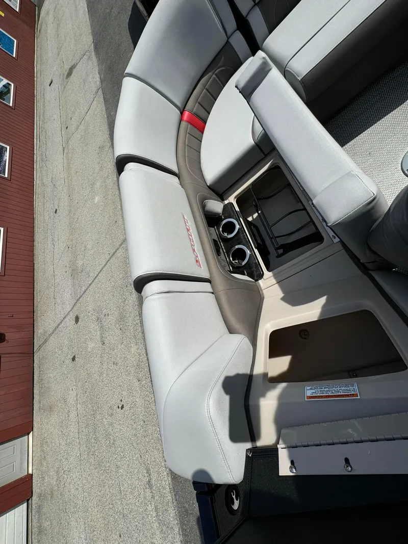 Slide: The Image of 2024 Princecraft VOGUE 23RL boat interior with gray seating and cup holders. - 31