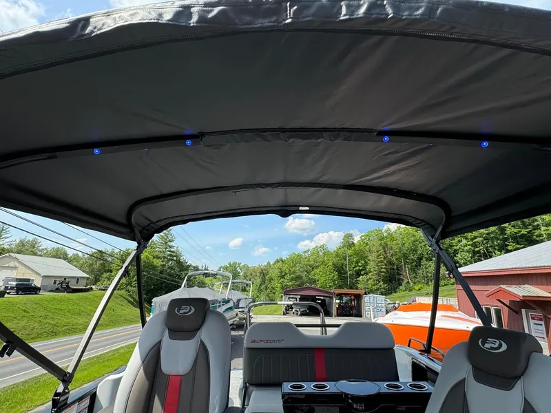 Slide: The Image of 2024 Princecraft VOGUE 23RL pontoon boat interior with canopy and seating. - 35