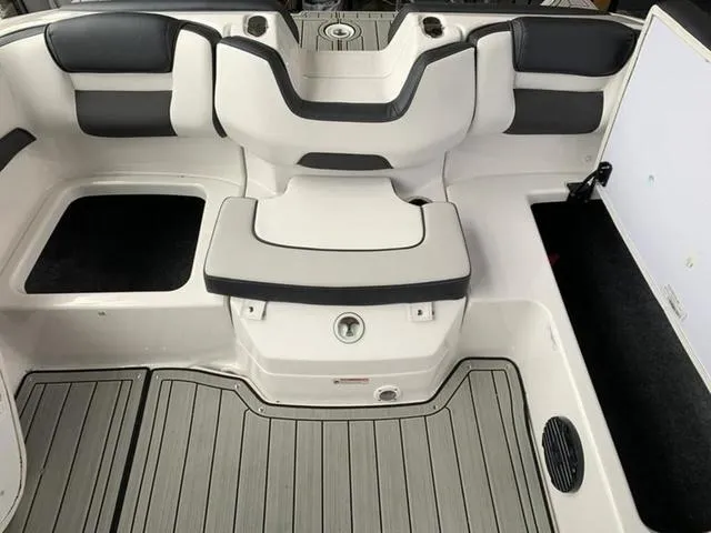 Slide: The Image of 2024 Yamaha Boats 195S interior seating and deck area with gray and white upholstery. - 13
