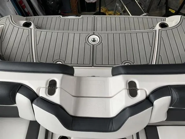 Slide: The Image of 2024 Yamaha Boats 195S swim platform with cushioned seating and non-slip decking. - 15