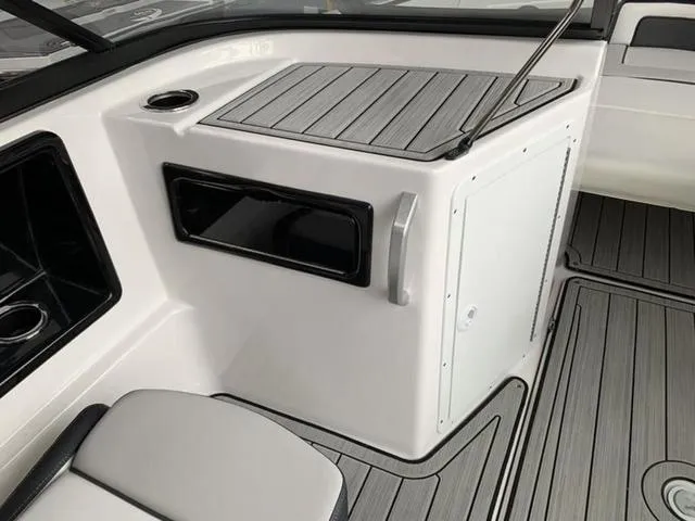 Slide: The Image of 2024 Yamaha Boats 195S interior, featuring sleek storage compartments and modern design. - 18