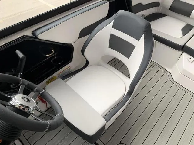 Slide: The Image of 2024 Yamaha Boats 195S cockpit with modern steering wheel and comfortable seating. - 5