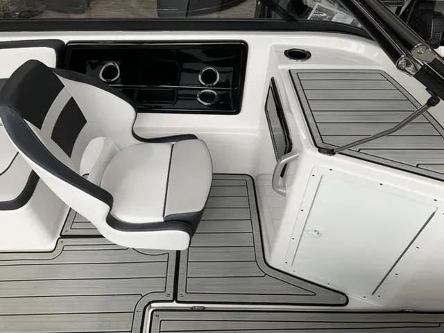Slide: The Image of 2024 Yamaha Boats 195S interior cockpit with white and black seating. - 6