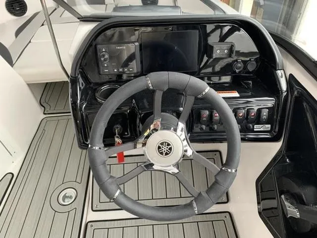 Slide: The Image of 2024 Yamaha Boats 195S steering console with modern controls and touchscreen display. - 9