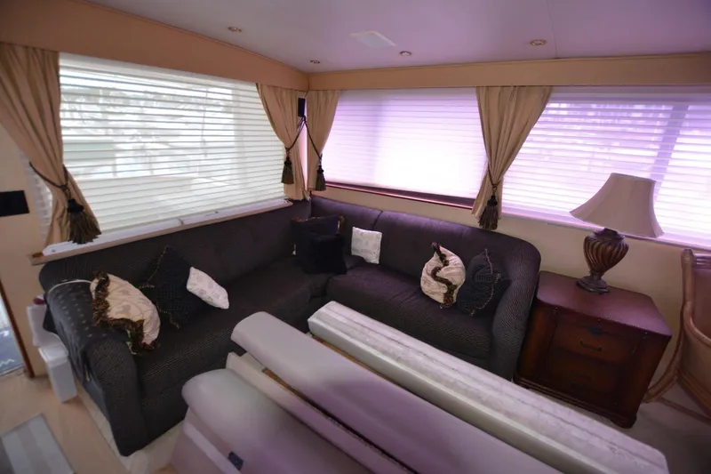 Slide: The Image of Interior of 1989 Hatteras Cockpit Motoryacht with cozy seating and elegant decor. - 12