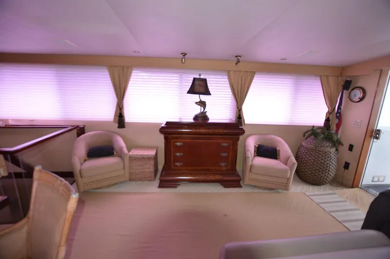Slide: The Image of Interior of 1989 Hatteras Cockpit Motoryacht with elegant seating and decor. - 13