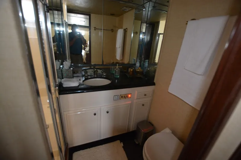 Slide: The Image of Bathroom interior of 1989 Hatteras Cockpit Motoryacht with sink and mirror. - 18