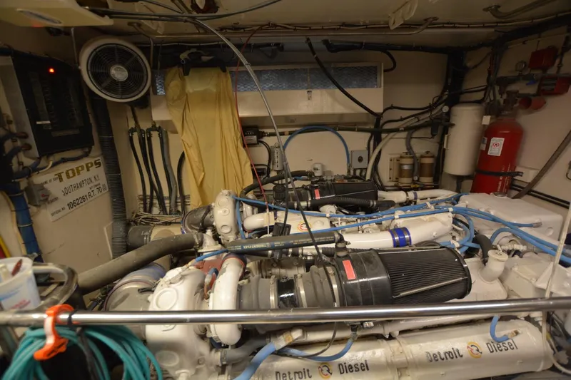 Slide: The Image of Engine room of 1989 Hatteras Cockpit Motoryacht with Detroit Diesel engines and various equipment. - 29