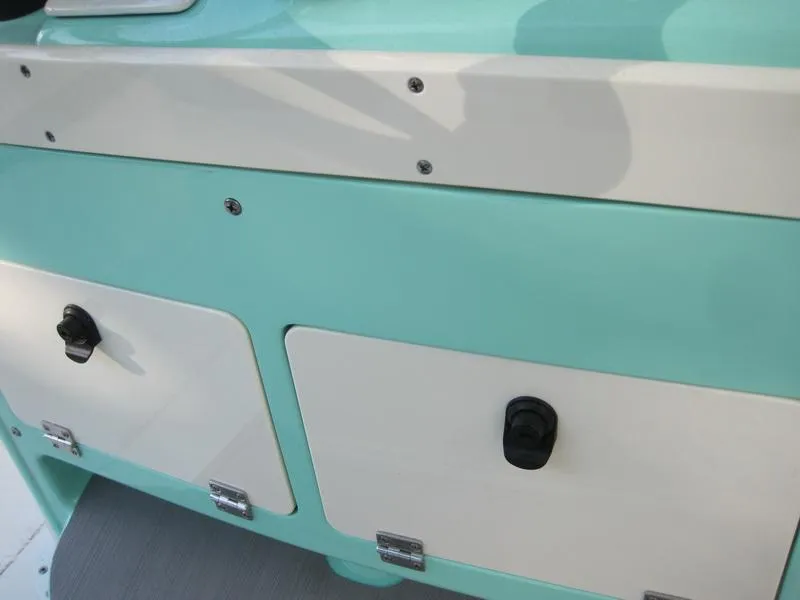 Slide: The Image of 2021 ShearWater 250 Carolina Bay storage compartments and latches. - 10
