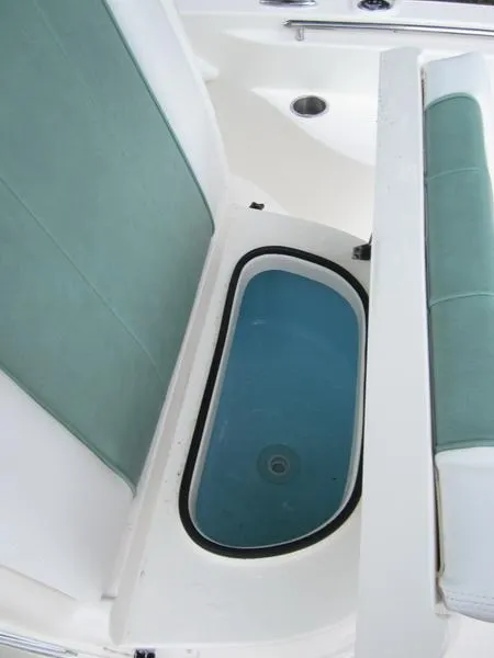 Slide: The Image of 2021 ShearWater 250 Carolina Bay boat seating and storage compartment. - 12