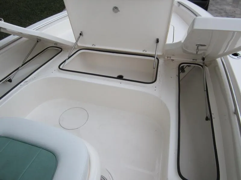 Slide: The Image of 2021 ShearWater 250 Carolina Bay boat storage compartments and seating area. - 15