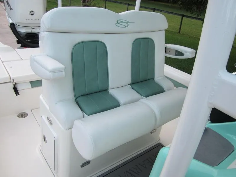 Slide: The Image of 2021 ShearWater 250 Carolina Bay boat with cushioned seating. - 5