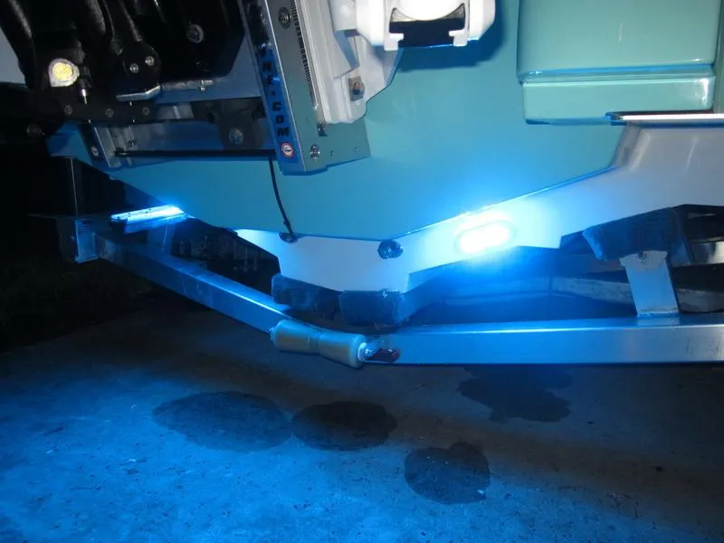 Slide: The Image of 2021 ShearWater 250 Carolina Bay boat with blue LED underwater lights. - 9