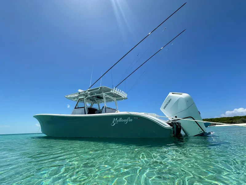 Slide: The Image of 2024 Yellowfin 39 boat in clear blue water under sunny sky. - 10