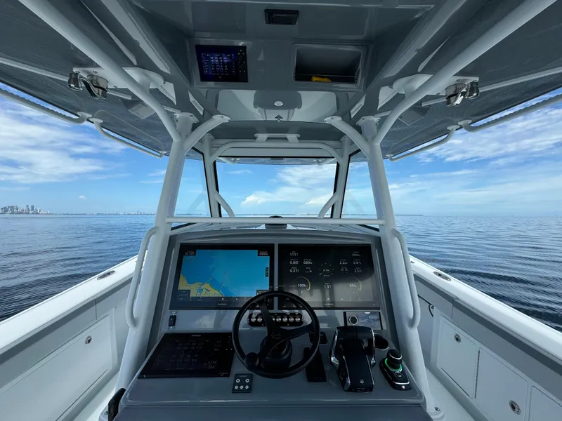 Slide: The Image of 2024 Yellowfin 39 boat helm with advanced navigation system on open water. - 13