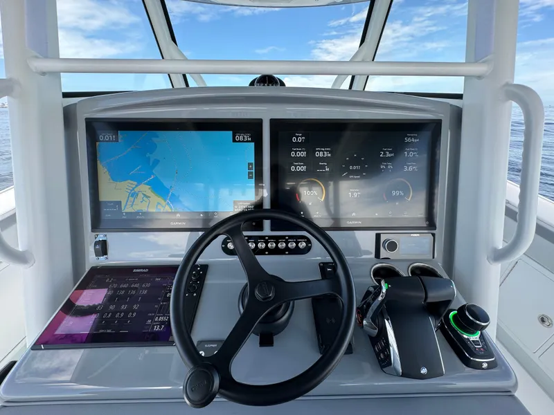 Slide: The Image of 2024 Yellowfin 39 boat dashboard with navigation screens and controls. - 14
