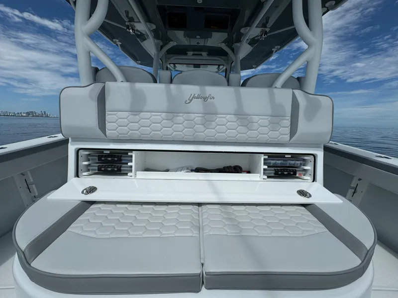 Slide: The Image of 2024 Yellowfin 39 boat with cushioned seating and storage compartments. - 18
