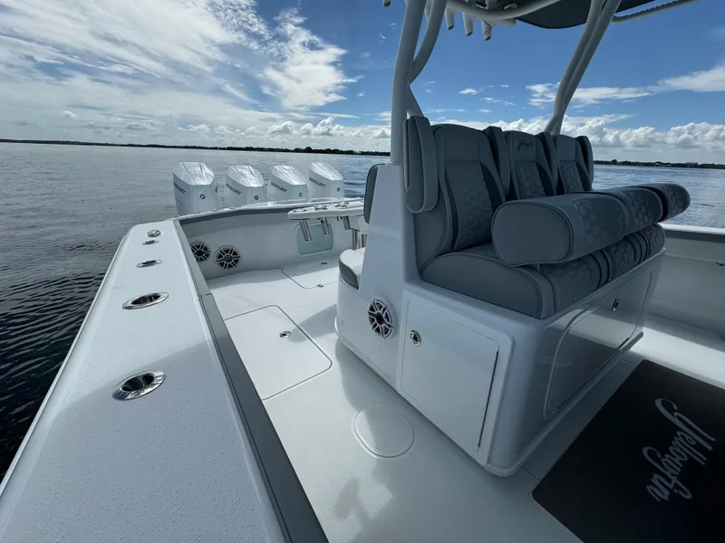 Slide: The Image of 2024 Yellowfin 39 boat interior with seating and multiple outboard engines. - 24