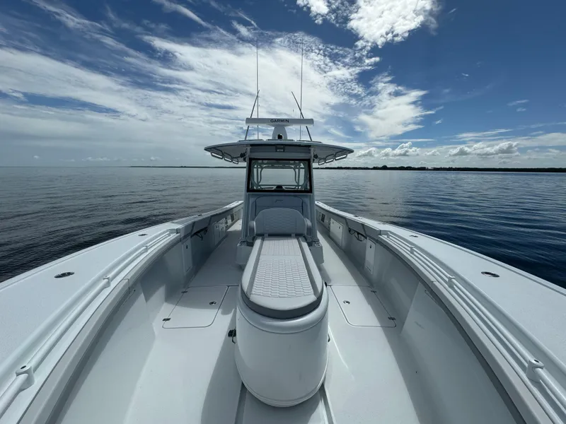 Slide: The Image of 2024 Yellowfin 39 boat on calm ocean under a partly cloudy sky. - 29