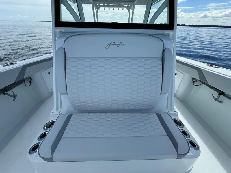 Slide: The Image of 2024 Yellowfin 39 boat with cushioned seating and cup holders. - 31