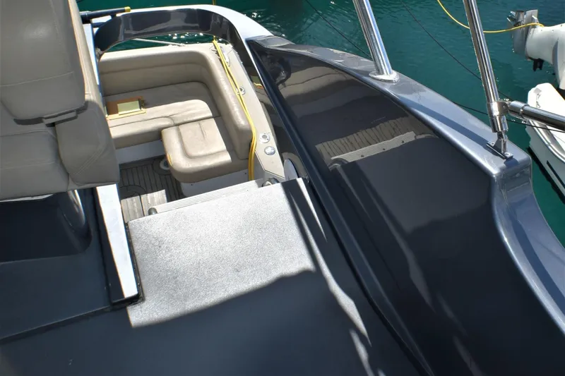 Slide: The Image of 2019 Silverton 41 Sport Bridge boat interior with seating and deck view. - 10