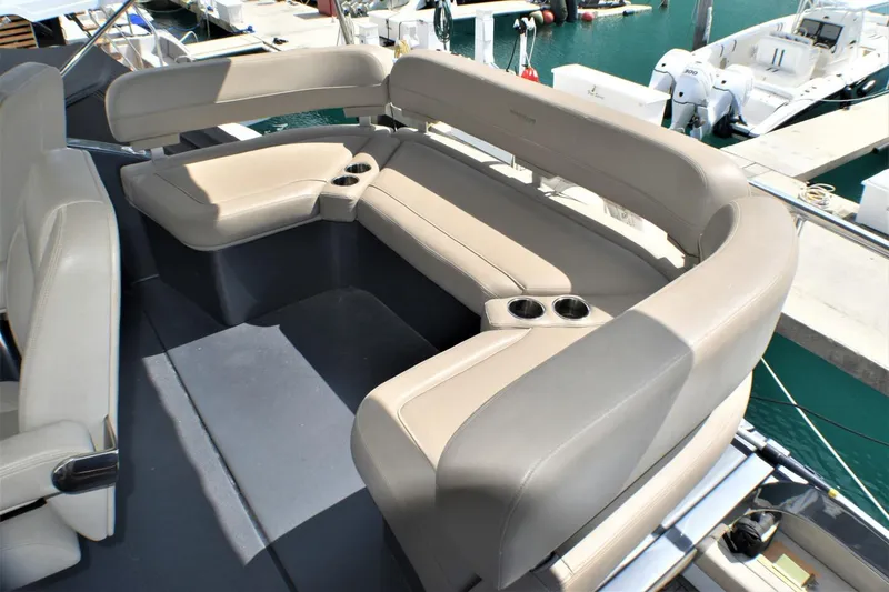 Slide: The Image of 2019 Silverton 41 Sport Bridge boat seating area with beige upholstery. - 11