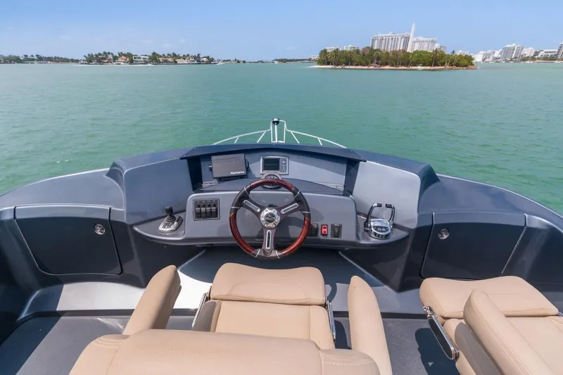 Slide: The Image of 2019 Silverton 41 Sport Bridge boat helm with ocean view - 16