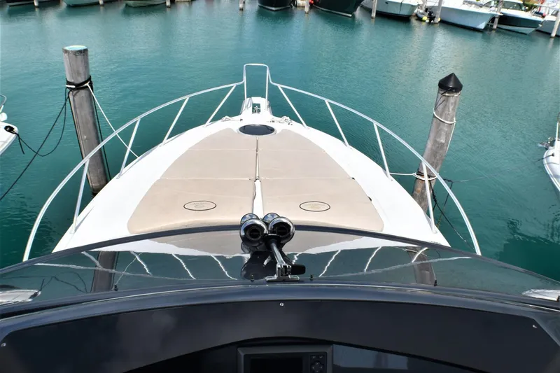 Slide: The Image of 2019 Silverton 41 Sport Bridge yacht docked at marina, view from helm. - 17