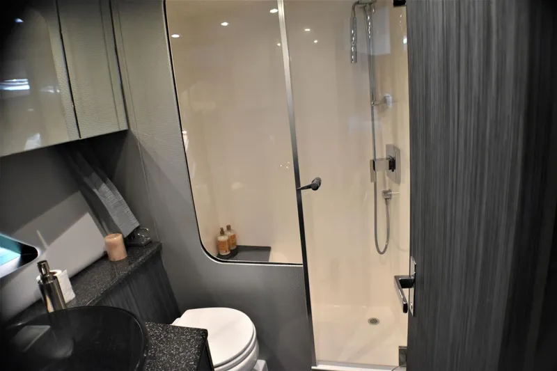 Slide: The Image of Modern bathroom in 2019 Silverton 41 Sport Bridge yacht with shower and sleek design. - 21