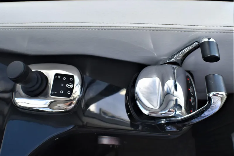 Slide: The Image of Silverton 41 Sport Bridge 2019 boat control panel with joystick and throttle. - 29