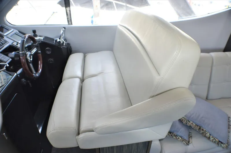 Slide: The Image of 2019 Silverton 41 Sport Bridge helm seat and dashboard. - 33