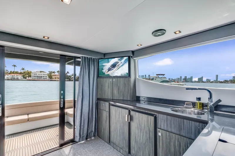 Slide: The Image of Interior of 2019 Silverton 41 Sport Bridge yacht with waterfront view. - 38
