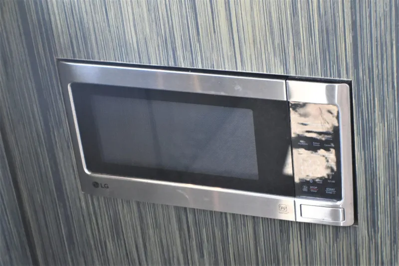 Slide: The Image of Built-in LG microwave in 2019 Silverton 41 Sport Bridge yacht kitchen. - 39