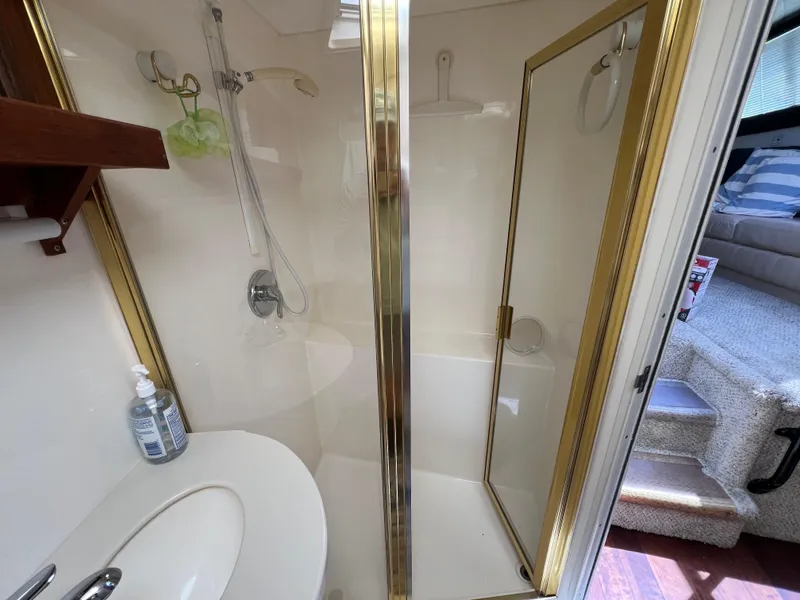 Slide: The Image of Bathroom interior of 1998 Mainship 47 Motor Yacht with shower and sink. - 40