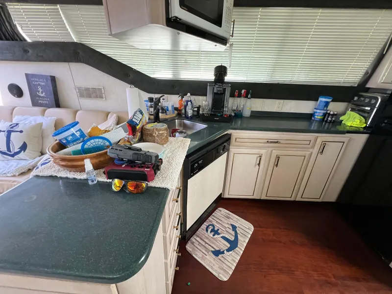 Slide: The Image of Interior of 1998 Mainship 47 Motor Yacht kitchen with countertop and appliances. - 46